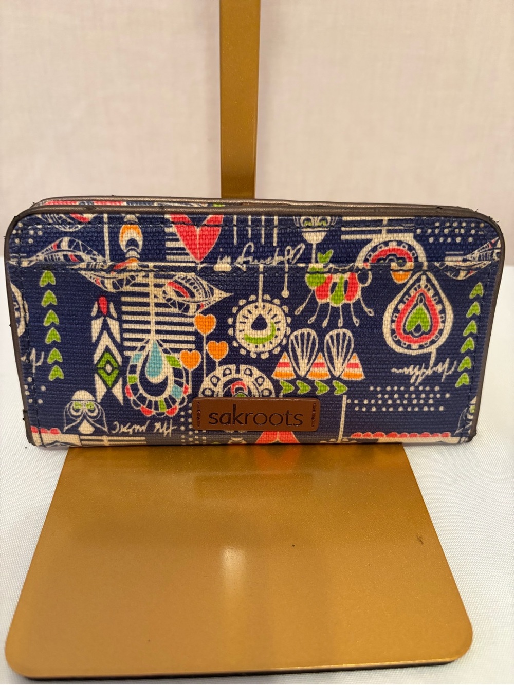Sakroots Artist Circle Slim Wallet in the Gold Songbird print